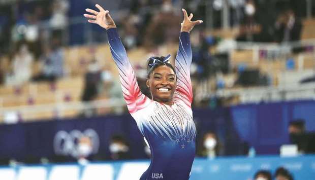 Simone Biles of the US reacts after performing on the balance beam during the Tokyo Olympics at the Ariake Gymnastics Centre. (Reuters)