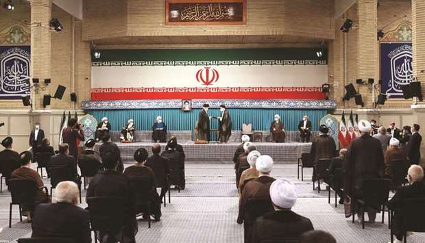 Iranu2019s new President Ebrahim Raisi receives the endorsement decree for his presidency from Supreme Leader Ayatollah Ali Khamenei, in Tehran, Iran, yesterday.