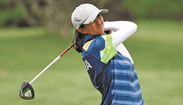 Indiau2019s Aditi Ashok plays a shot during round one of the womenu2019s golf at the Tokyo Olympics in Saitama, Japan, yesterday. (Reuters)