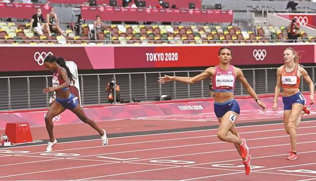 USAu2019s Sydney Mclaughlin (centre) crosses the finish line ahead of compatriot Dalilah Mohamed (left) and Netherlandsu2019 Femke Bol in the womenu2019s 400m hurdles final at the Olympic Stadium in Tokyo yesterday. (AFP)