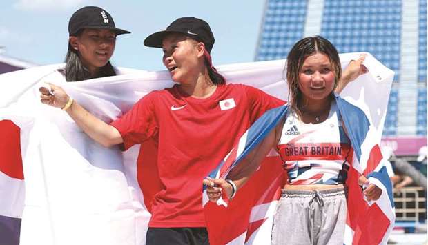 Silver-medallist Japanu2019s Kokona Hiraki (left), gold-medallist Japanu2019s Sakura Yosozumi (centre) and bronze-medallist Britainu2019s Sky Brown pose on the podium after the womenu2019s skateboarding park final at the Tokyo Olympic Games yesterday. (AFP)