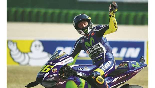 In this file photo taken on September 11, 2016, Movistar Yamaha MotoGPu2019s Italian rider Valentino Rossi celebrates after finishing second in the San Marino MotoGP Grand Prix race at the Marco Simoncelli Circuit in Misano. (AFP)