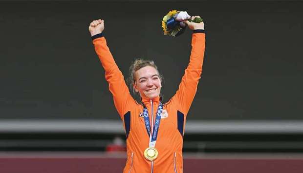 Gold medallist Netherlandsu2019 Shanne Braspennincx poses on the podium after winning the track cycling keirin final in Izu, Japan. (AFP)