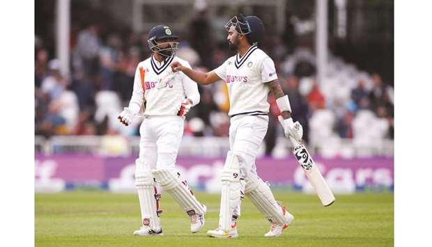 Indiau2019s KL Rahul (right) and Ravindra Jadeja walk off the pitch for a break during the third day of the first Test at Trent Bridge in Nottingham, Britain, yesterday. (Reuters)