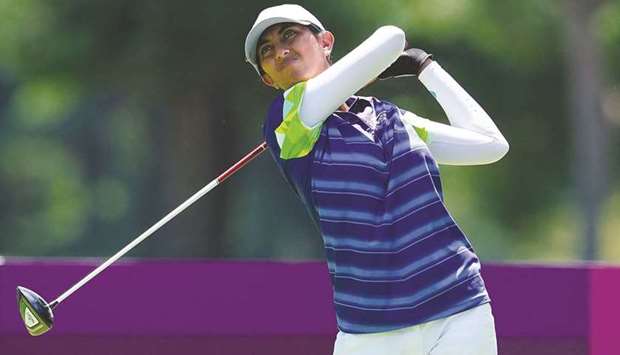 Indiau2019s Aditi Ashok plays a shot during the third round of the womenu2019s golf at Tokyo Olympics at the Kasumigaseki Country Club. (AFP)