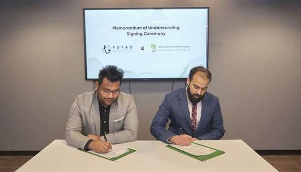 AYCMQA executive director Neeshad Shafi (left) and Futad Advertising co-founder & managing partner Mirsab al-Rahman during the signing ceremony.