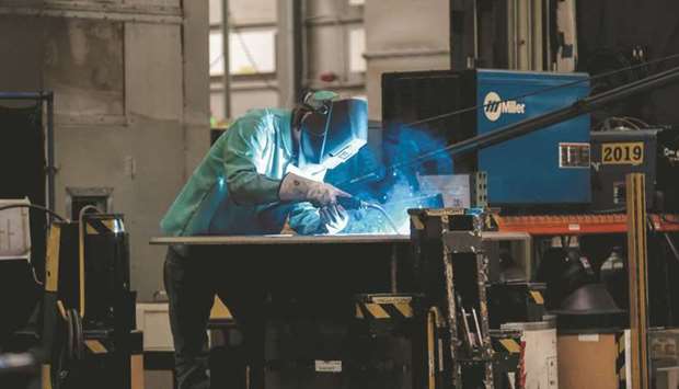 An employee welds at a manufacturing facility in Shippensburg, Pennsylvania. The strengthening US economy is relieving pressure on President Joe Biden and congressional Democrats to extend a series of assistance programmes that kept Americans afloat during the pandemic, including enhanced unemployment benefits due to expire in just four weeks.