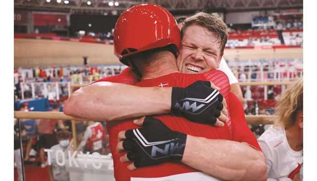 Gold medallist Denmarku2019s Lasse Norman Hansen (right celebrates with his teammate Michael Morkov after winning in the menu2019s track cycling madison final at Izu Velodrome in Izu, Japan. (AFP)