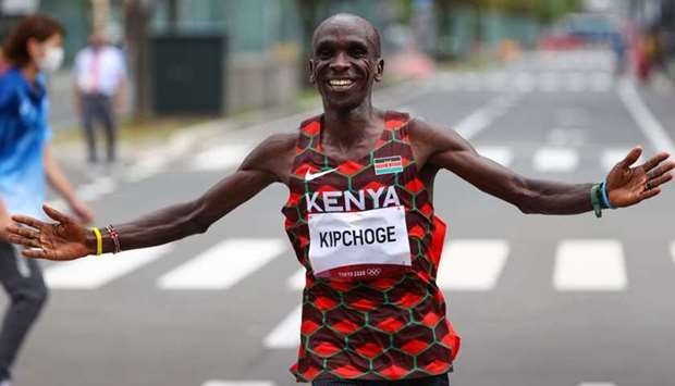 Eliud Kipchoge of Kenya celebrates after winning gold. REUTERS/Kim Hong-Ji