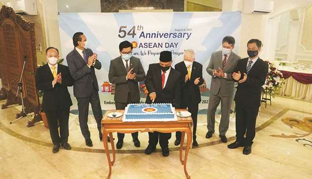Asean ambassadors in Doha at the Asean Day cake-cutting ceremony on Sunday.