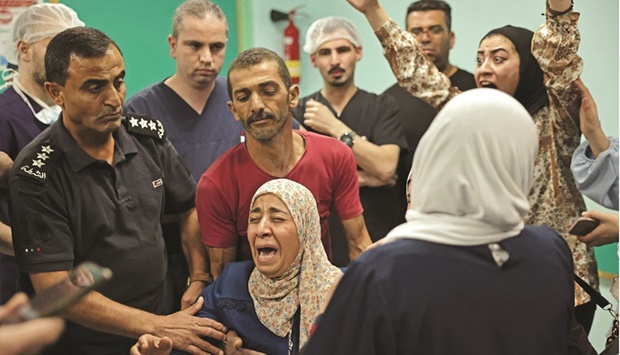 Mother of Palestinian Moamen Yassin Jaber reacts after the 17-year-old was announced dead at al-Ahli hospital in the southern city of Hebron following clashes between Palestinians and Israeli forces.