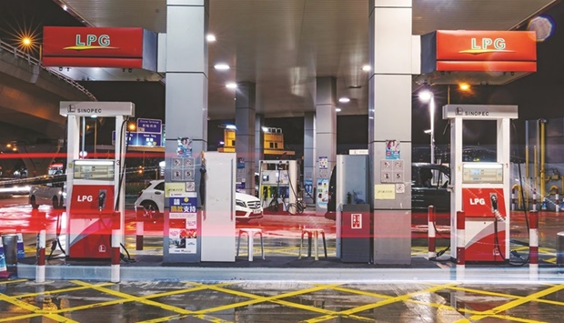 Gas pumps stand at a China Petroleum & Chemical Corp (Sinopec) gas station in Hong Kong. Five of Chinau2019s largest state-owned companies announced plans to delist from US exchanges as the two countries struggle to come to an agreement allowing American regulators to inspect audits of Chinese businesses.