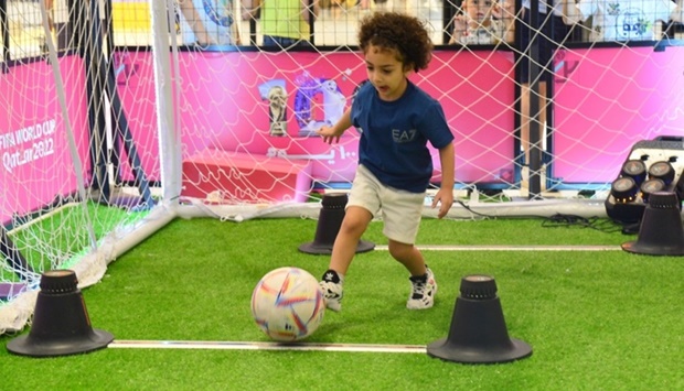 A boy takes part in a football challenge Friday during the '100 days to go' World Cup countdown at Place Vendome in Lusail. PICTURE: Shaji Kayamkulam.