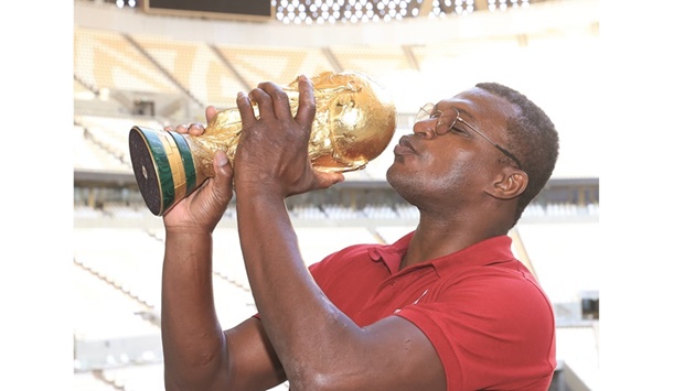 Marcel Desailly with the FIFA World Cup trophy at Lusail Stadium.