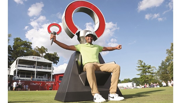 Tony Finau of the US poses with the trophy after winning the Rocket Mortgage Classic at Detroit Golf Club in Detroit, Michigan. (AFP)