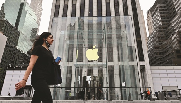 A person walks past the Apple store on Fifth Avenue in New York City. The worldu2019s most valuable company has the biggest influence on the S&P 500 Index and its participation in the market-capitalisation weighted benchmark is essential to any sustainable rally.