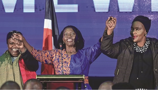 Martha Karua (centre), running mate of the Azimio la Umoja political coalition presidential flag bearer, Raila Odinga, dances with some of the elected, allied women candidates before giving an address to elected gubernatorial, national and county legislators at Azimiou2019s Elected Leaders Inaugural Conference in Nairobi.