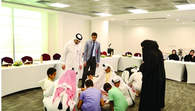 Children of Qatar Charity's staff take part in the u2018Little Employeeu2019 initiative.