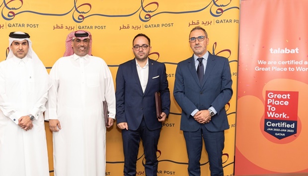 Qatar Post and talabat officials at the launch of the new initiative.