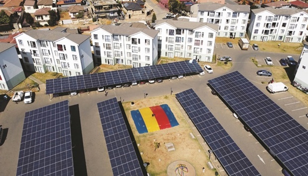 As power crisis worsens, solar panels are seen next to housing units at the Palm Springs residential estate in Cosmo City, in Johannesburg, South Africa, early this month. (Reuters)