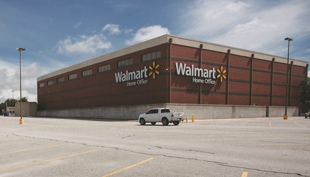 Walmart world headquarters in Bentonville. Walmart nudged up its annual profit forecast yesterday, partly reversing a hefty cut less than a month ago, as discounts to clear excess merchandise and lower fuel prices helped it beat expectations for quarterly sales.