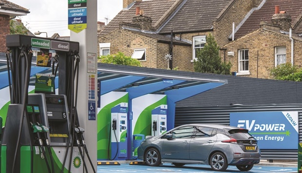 A BP petrol station forecourt with fuel pumps and plug-in electric-vehicle charging points in London. More than $4.8bn has been pumped into the electric-vehicle charging industry this year u2014 a combination of roll-out announcements, debt financing, investment and acquisitions.