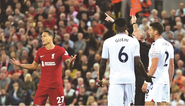 Liverpoolu2019s Darwin Nunez (left) reacts after being shown a red card by referee Paul Tierney during the Premier League game against Crystal Palace at Anfield in Liverpool, Britain, on Monday. (Reuters)
