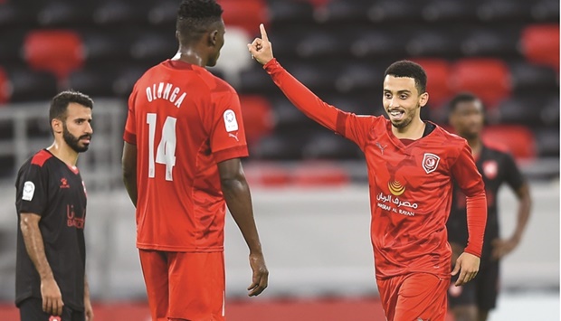 Al Duhailu2019s Khaled Mohamed celebrates (right) after scoring against Al Rayyan in the QNB Stars League at the Ahmed Bin Ali Stadium on Tuesday. PICTURE: Noushad Thekkayil