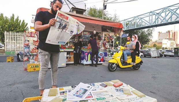 A man reads the Iranian newspaper Etemad, with the front page title reading in Farsi u201cThe night of the end of the JCPOAu201d, and cover photos of Iranu2019s Foreign Minister Hossein Amir-Abdollahian and his deputy and chief nuclear negotiator Ali Bagheri Kani, in the capital Tehran yesterday. The European Union and United States said they were studying Iranu2019s response to a u201cfinalu201d draft agreement on reviving a 2015 nuclear accord with major powers the EU presented at talks in Vienna.