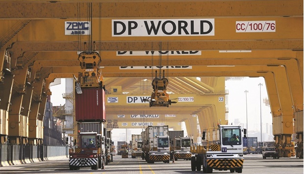 Terminal tractors line up to load containers into a cargo ship at DP Worldu2019s fully automated Terminal 2 at Jebel Ali Port in Dubai (file). The company, one of the worldu2019s biggest port operators, said its H1 profit climbed 51.8%, up from $475mn in the same period a year ago.
