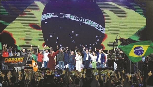 Former president Lula da Silva attends a campaign rally with his wife Janja at the Estacao square in Belo Horizonte, Brazil.