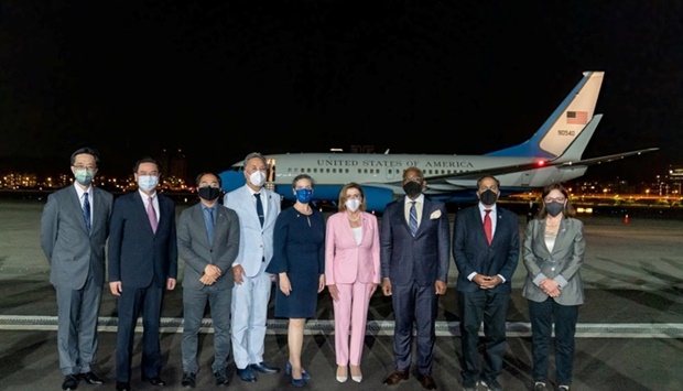 Taiwan Foreign Minister Joseph Wu poses a group photo with US House of Representatives Speaker Nancy Pelosi, American Institute in Taiwan Director Sandra Oudkirk and other members of the delegation at Taipei Songshan Airport in Taipei, Taiwan. Ministry of Foreign Affairs/Handout via REUTERS