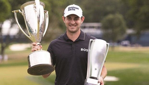 Patrick Cantlay poses with the BMW and Western Golf Association trophies after winning the BMW Championship golf tournament. (USA TODAY Sports)