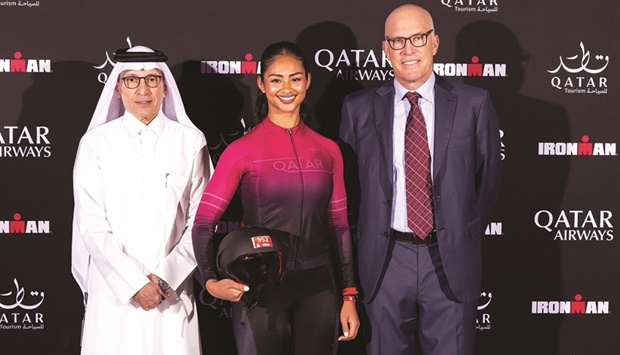 Qatar Airways Group Chief Executive and Qatar Tourism Chairman HE Akbar al-Baker (left) with President and CEO of The Ironman Group Andrew Messick (right) and Qatari athlete Lulwa al-Marri.