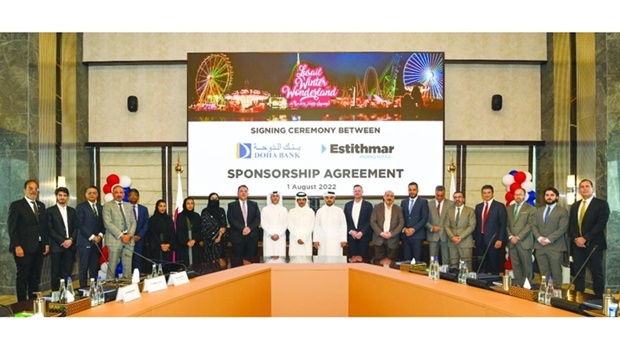 Officials of Doha Bank and Estithmar Holding at the agreement signing.