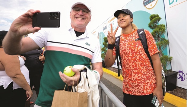 Naomi Osaka of Japan interacts with a fan during the Mubadala  Silicon Valley Classic, part of the Hologic WTA Tour, at Spartan  Tennis Complex in San Jose, California. (AFP)