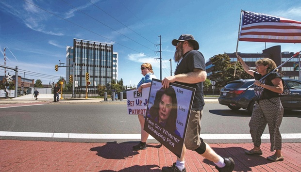 Demonstrators make their way to protest the recent actions of the FBI at their Boston headquarters in Chelsea, Massachusetts on Sunday. The protest was in reaction to the FBIu2019s investigation on former US President Donald Trump and the raid on his home in Florida.