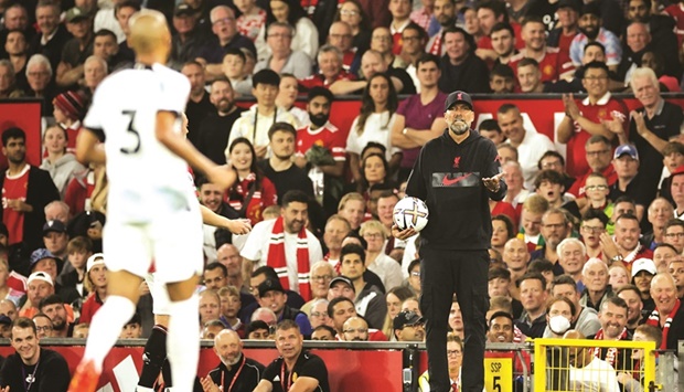 Liverpool manager Jurgen Klopp (right) gives instructions to his players during the Premier League match against Manchester United on Monday.  (Reuters)