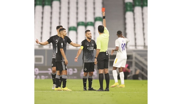 Al Saddu2019s captain Rodrigo Tabata (centre) is shown a red card during the QNB Stars League match against Al Gharafa at the Education City Stadium on Tuesday. PICTURE: Noushad Thekkayil
