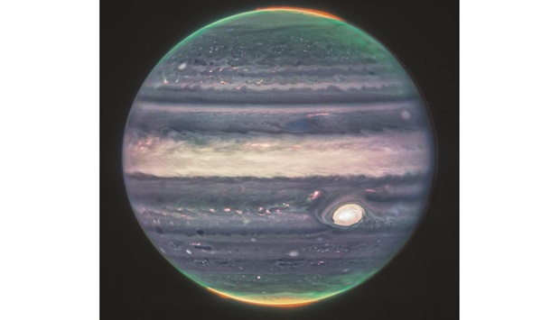 This image, obtained from Nasa and taken by the James Webb Space Telescope, shows Jupiteru2019s weather patterns, tiny moons, altitude levels, cloud covers and auroras at the northern and southern poles.