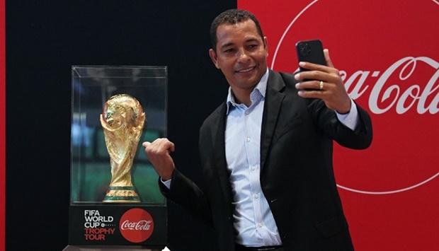 Former Arsenal player and 2002 FIFA World Cup winner Gilberto Silva with the FIFA World Cup trophy.