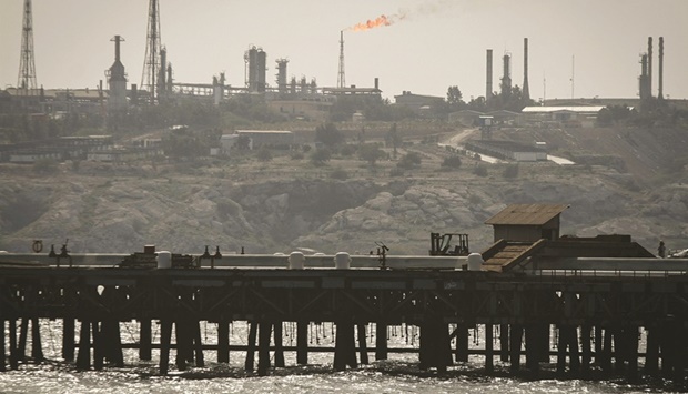 An oil facility in the Khark Island (file). Potential Opec+ production cuts mooted this week by Saudi Arabia may not be imminent and are likely to coincide with the return of Iran to oil markets should it clinch a nuclear deal with the West, nine Opec sources told Reuters on Tuesday.