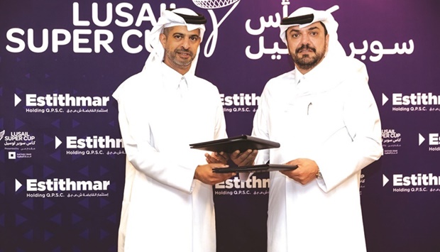 FIFA World Cup Qatar 2022 LLC CEO Nasser al-Khater (left) and Chairman of Estithmar Holding Moutaz al-Khayyat during the partnership signing ceremony at the Al Bidda Tower.