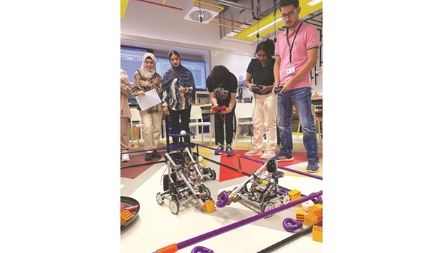 High school students explore robotics concepts at Tamuq programme.