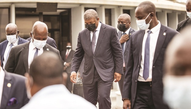 Angolau2019s President Joao Lourenco (centre) walks out of a meeting at the Peopleu2019s Movement for the Liberation of Angola (MPLA) party headquarters, two days after general elections, in Luanda. Angola is awaiting for the announcement of the results of the August 24 general elections, which will decide the next president, with counts indicating a probable victory for the historic ruling MLPA party in the countryu2019s most hotly contested election in its democratic history.