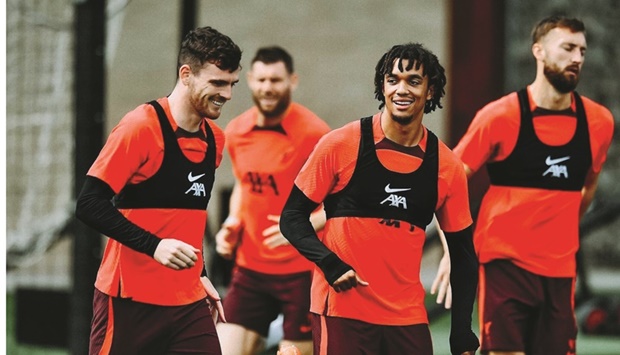 Liverpool players at a training session yesterday.