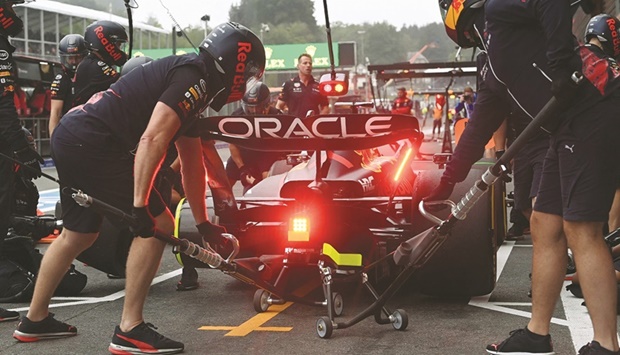 Red Bull crew change the tyres of Dutch driver Max Verstappenu2019s car during the second free practice for the Belgian Formula One Grand Prix at Spa-Francorchamps racetrack in Spa yesterday. (AFP)