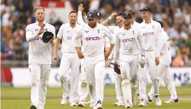 Englandu2019s captain Ben Stokes (left) celebrates with teammates after winning the second Test against South Africa at the Old Trafford in Manchester yesterday. (Reuters)