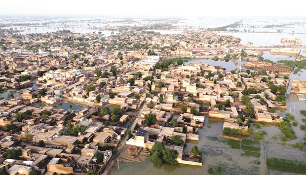 This aerial view shows a flooded residential area after heavy monsoon rains in Balochistan province yesterday. (AFP)