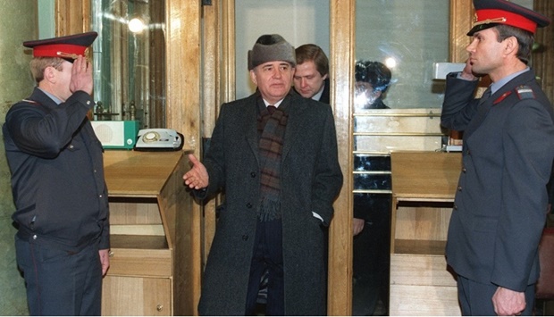 In this file photo taken on January 14, 1992 former Soviet President Mikhail Gorbachev (C) enters the institute which carries his name, the Gorbachev Foundation, in Moscow.